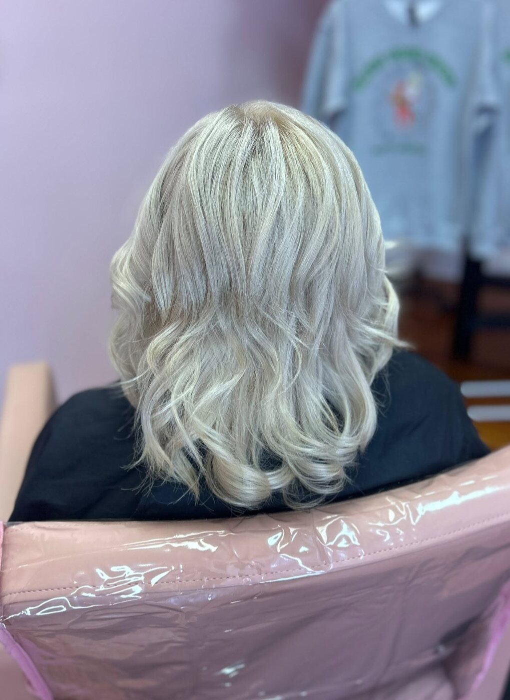 Icy platinum blonde lob with soft curls
